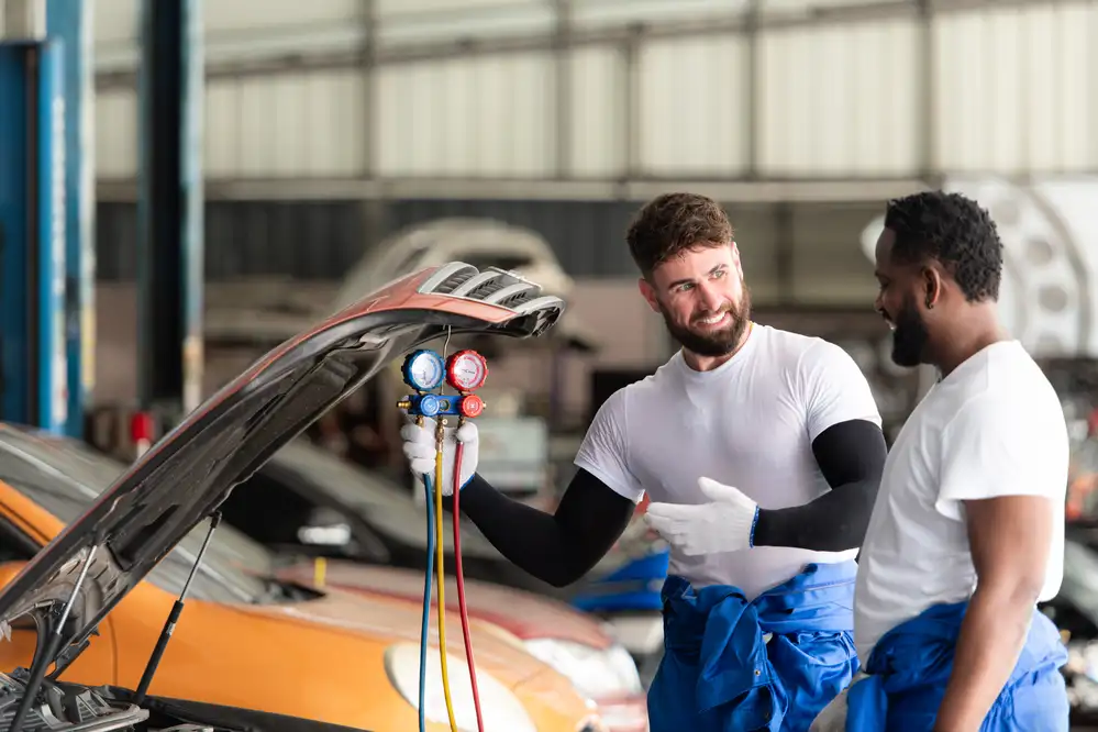 Mechanic performing regular maintenance and inspections on a car to prevent costly repairs